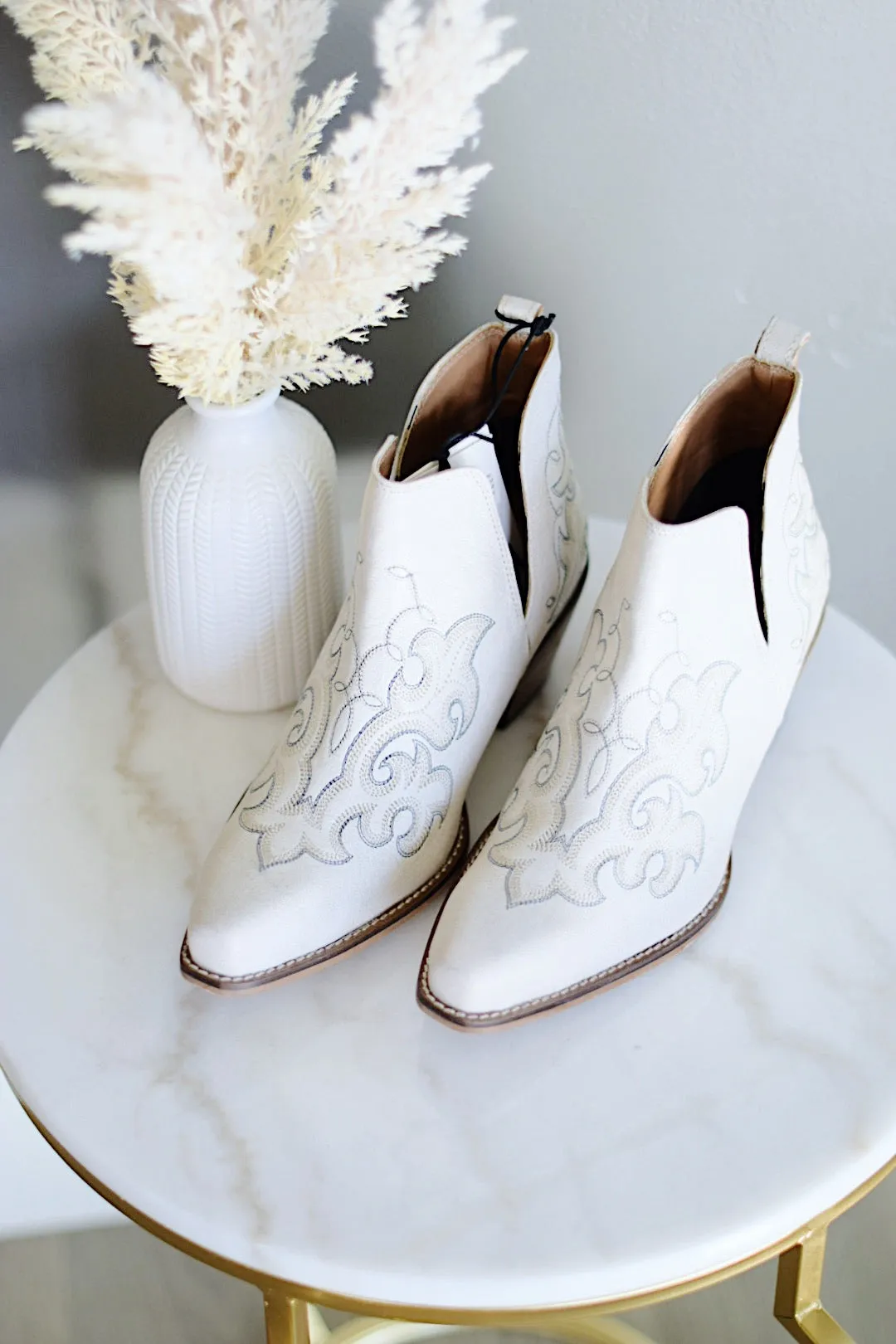 La Ponderosa Booties In Ivory Suede